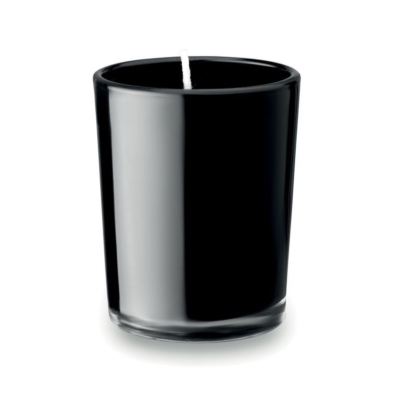 Small candle in glass